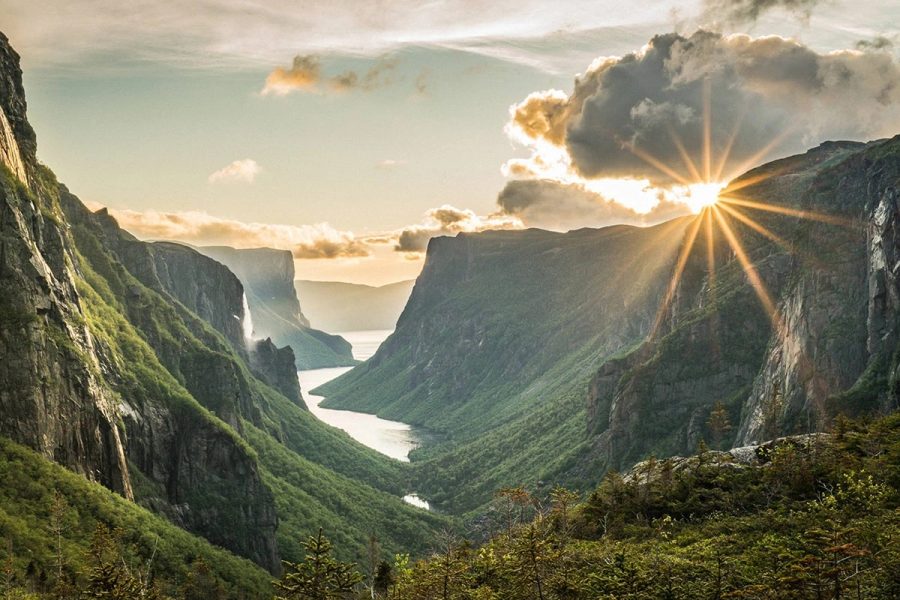 Dramatic fjord cliffs and green hills of Gros Morne National Park.